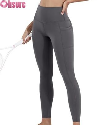 Vrouwelijke hoge middenbekkens, maagcontrole, yoga leggings met elastische bekleding van de taille en zakken