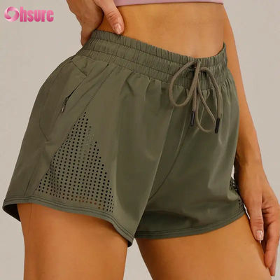 Groothandel Vrouwen Sport Workout Shorts ademend laser gesneden joggen Shorts met warmte-up Zipper Side Pocket Solid Pattern