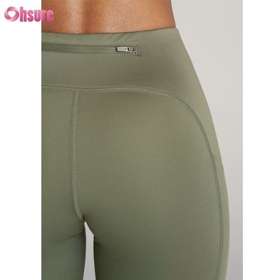 Getextureerde sportleggings fitness yoga sportbroek met ritssluiting ontwerp sport yoga leggings voor vrouwen